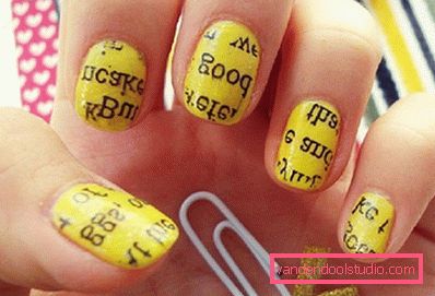 yellow manicure with a newspaper