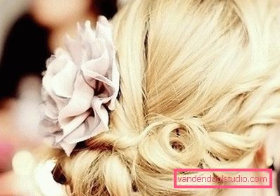 wedding curls with a flower on the side of the head